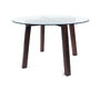 Il tavolo rotondo DALTON piano in vetro - piedi in quercia massiccia