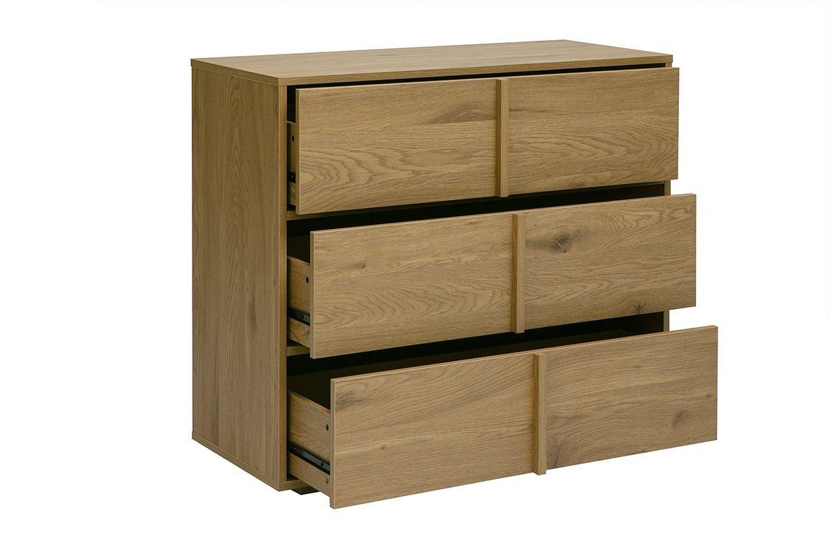 Com� in rovere chiaro con 3 cassetti, vista a 3/4, senza maniglia visibile.