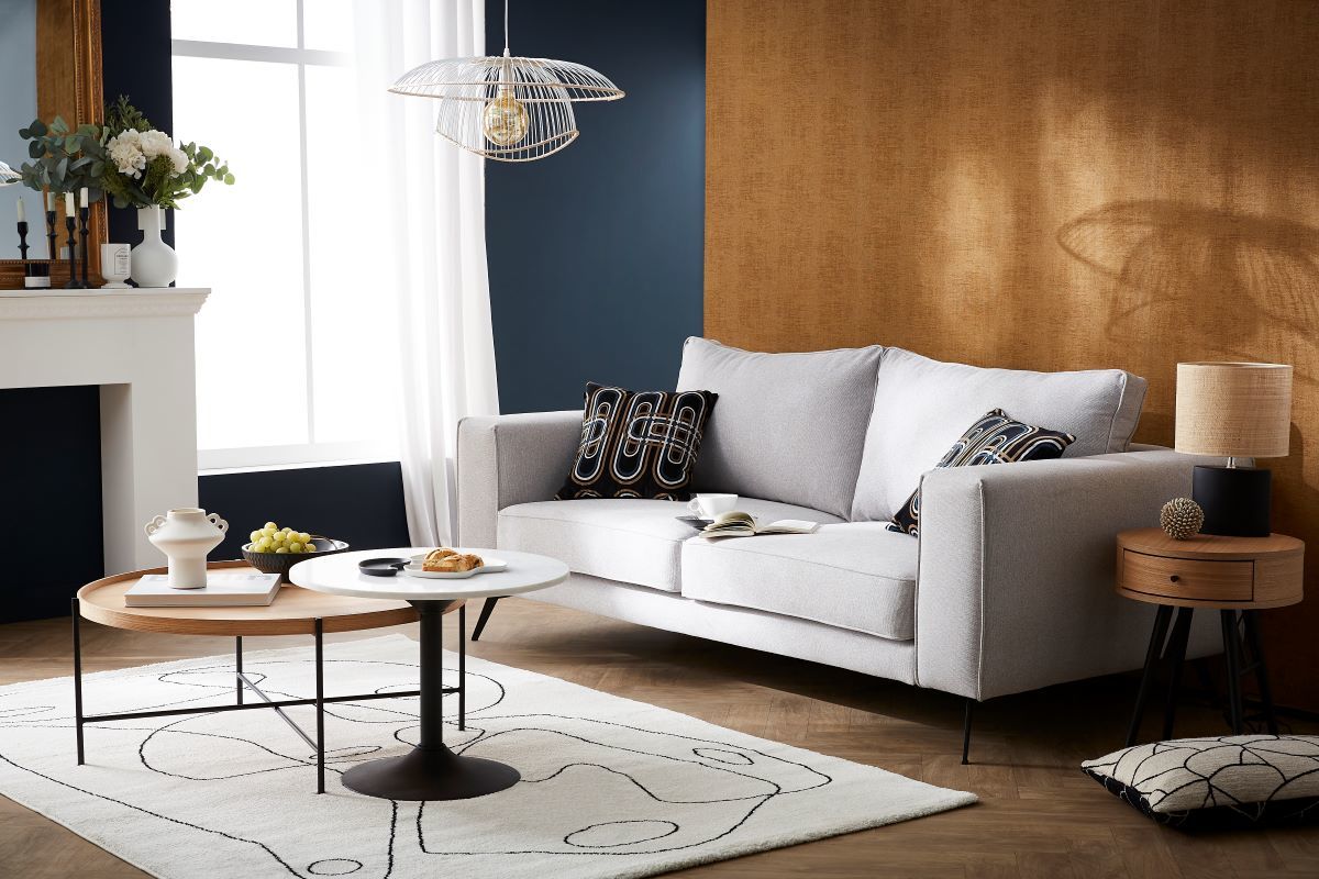 Divano design 4 posti in tessuto beige e metallo nero OSMANN