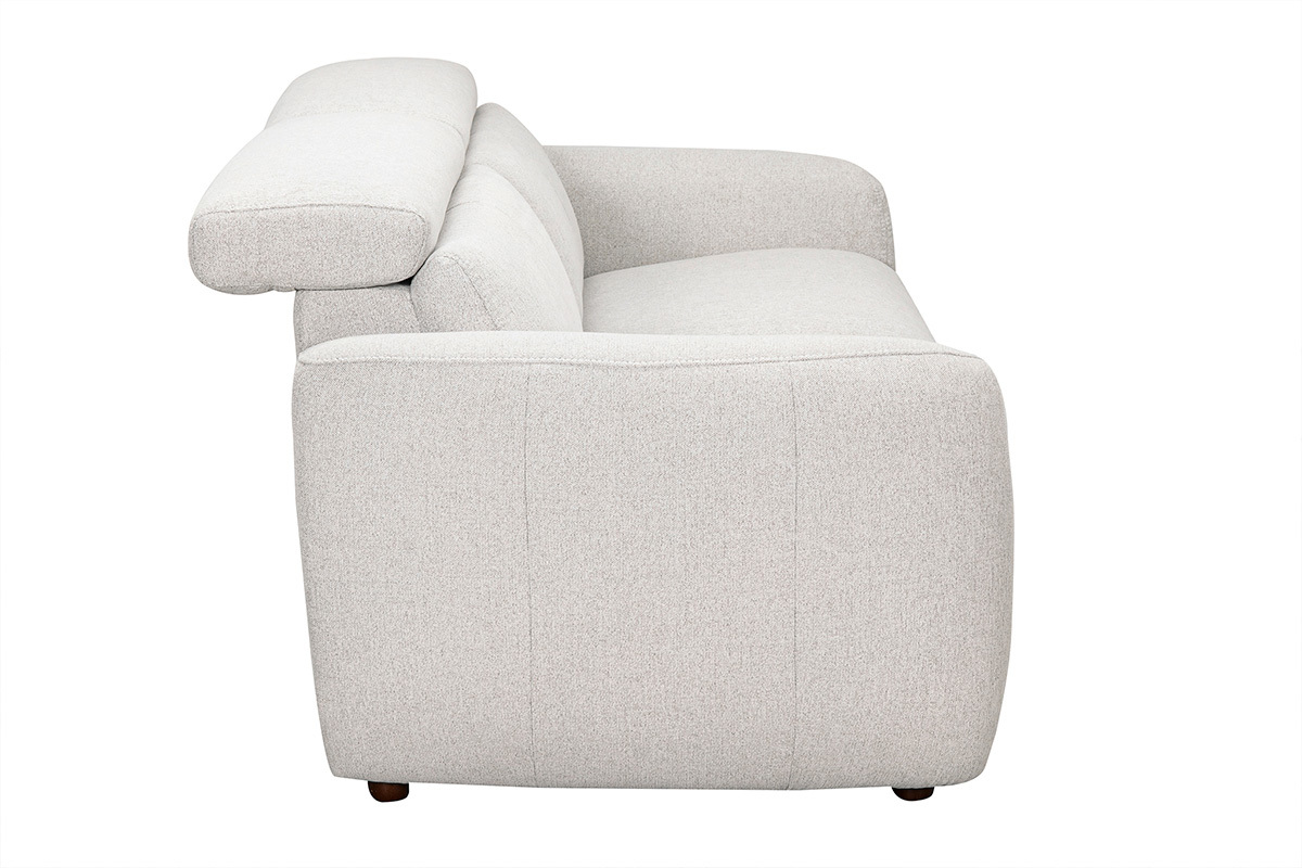 Divano elettrico beige, vista laterale con poggiatesta regolabili e poggiapiedi, tessuto effetto velluto testurizzato.