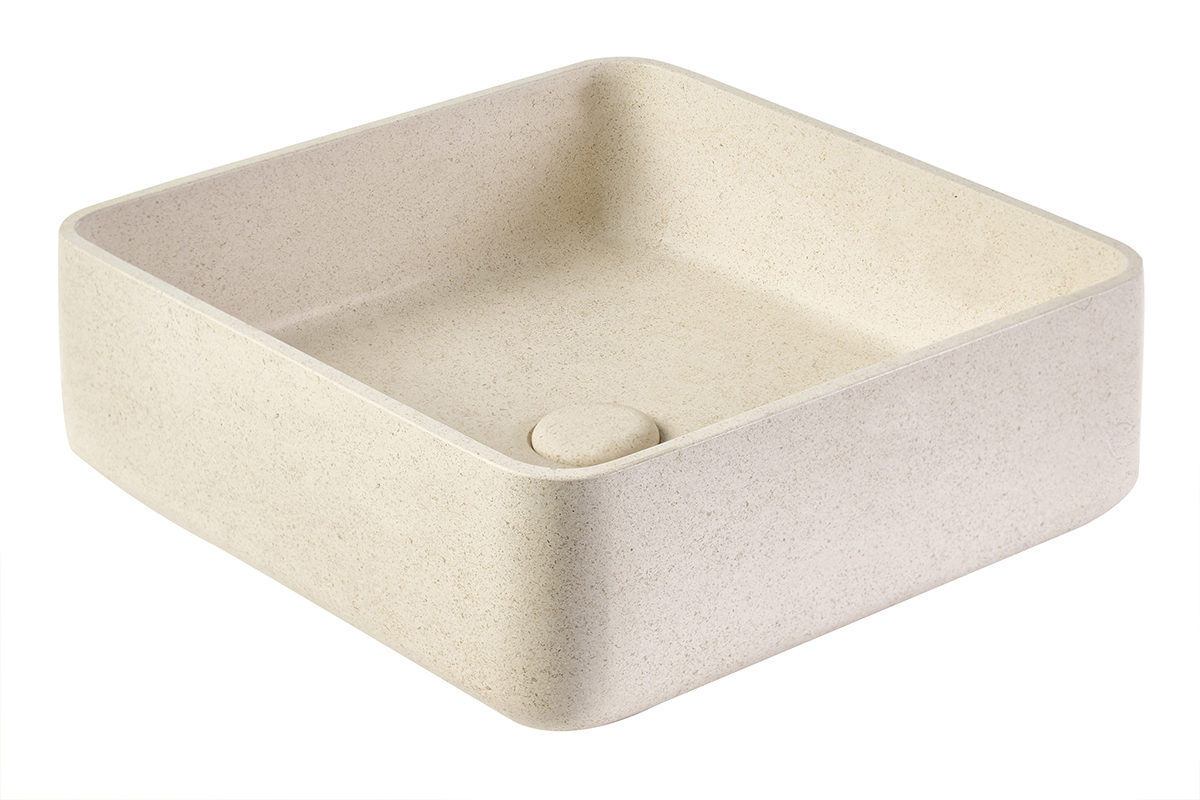 Lavabo quadrato in pietra naturale beige, vista a 3/4, finitura opaca.