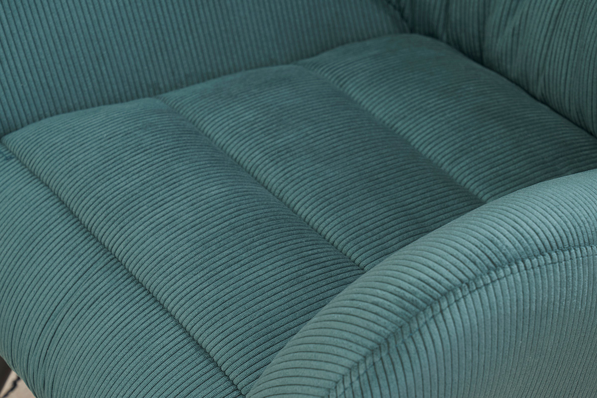 Primo piano sul tessuto in velluto a coste verde della poltrona ZOE.