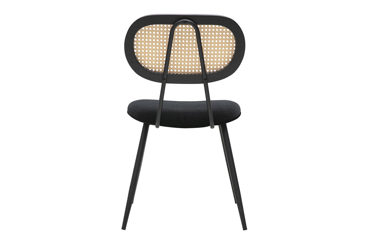 Sedia design nera in velluto e rattan vista da dietro, struttura in metallo nero.