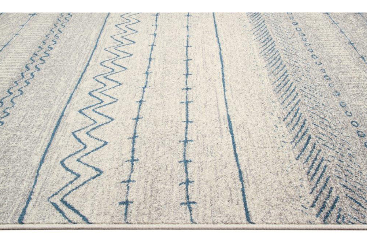 Tappeto a motivi beige e blu 150 x 220 cm TRIBAL
